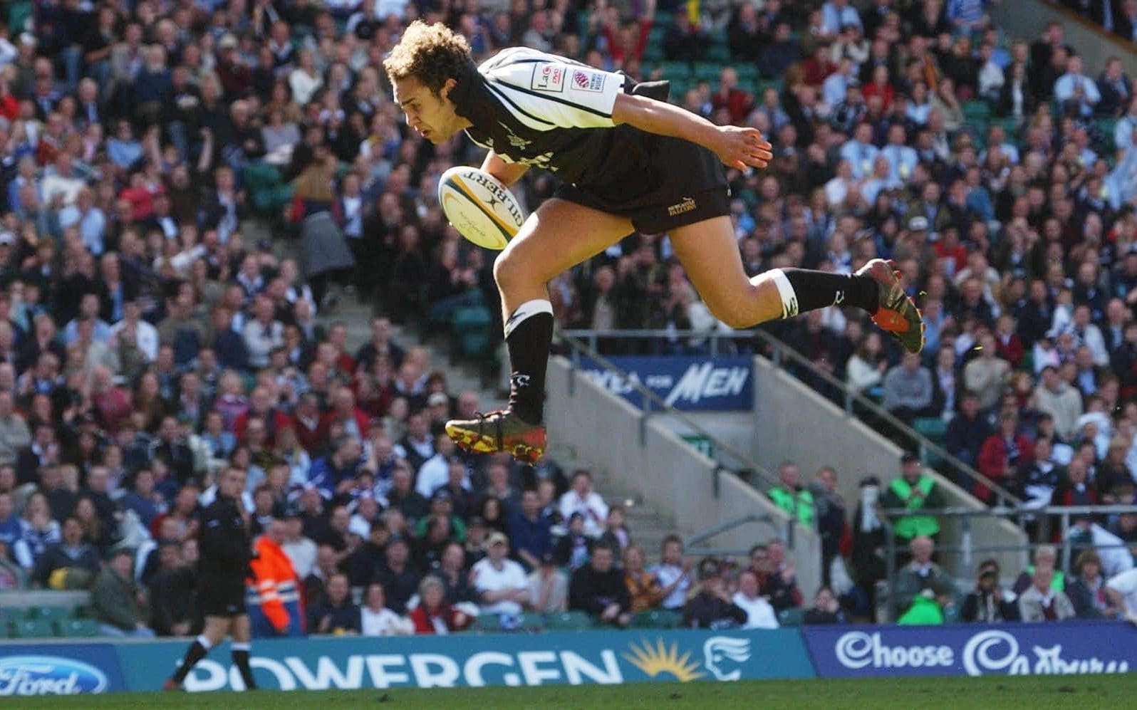 Joe Shaw goes airborne to score a try during Newcastle's victory over Sale in the 2004 Powergen Cup final