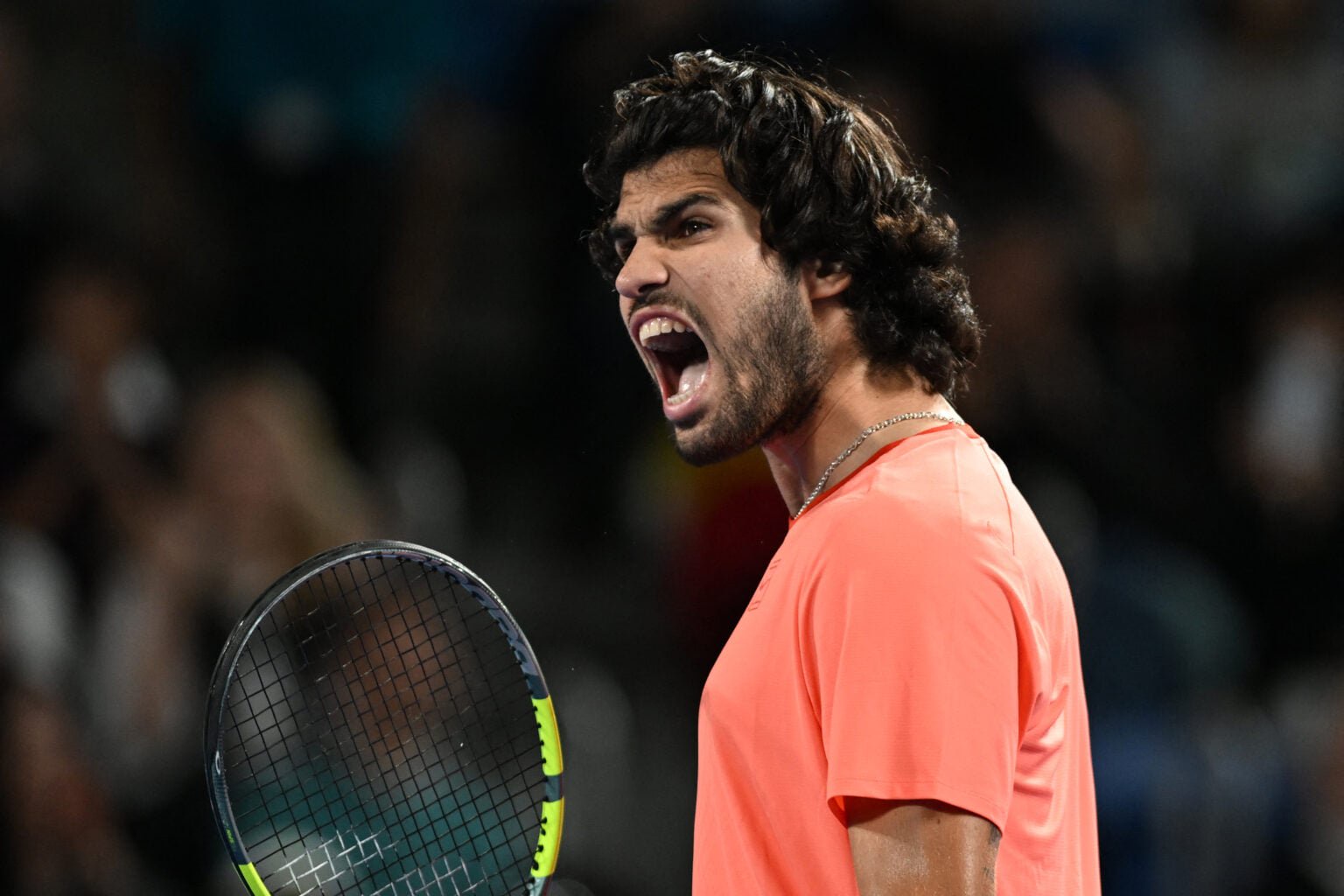 Carlos Alcaraz celebrates after reaching the Japan Open final.