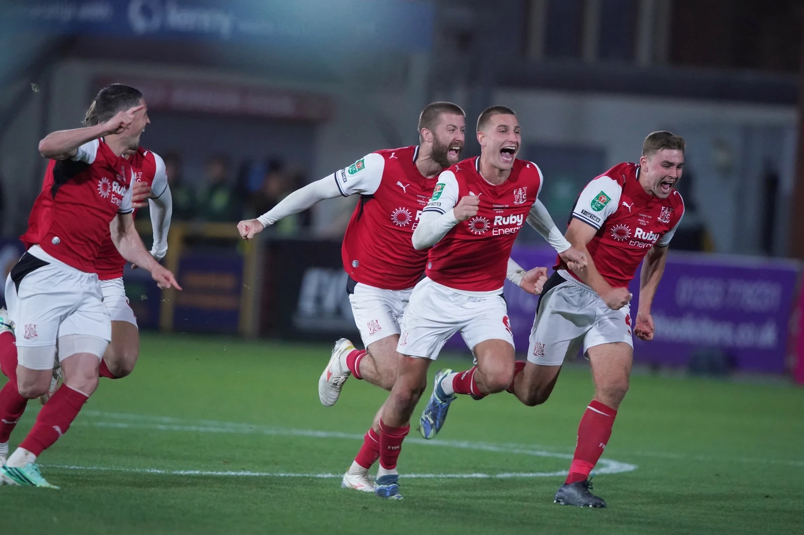 Fleetwood's players celebrate after winning a penalty shootout during the English League Cup soccer match between Fleetwood Town and Arsenal in Fleetwood, England, Tuesday, Oct. 27, 2026. (AP)