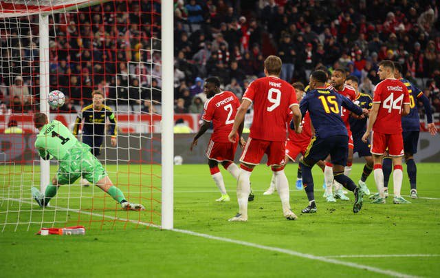 Manuel Neuer of FC Bayern Muenchen makes a save against Arsenal