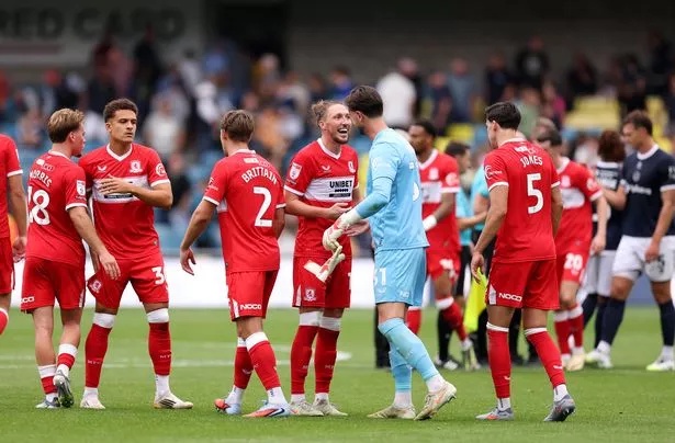 Luke Ayling and Sol Brynn of Middlesbrough embrace at full-time following the Sky Bet Championship match between Millwall and Middlesbrough