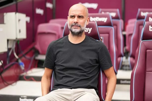 Pep Guardiola on the Manchester City bench