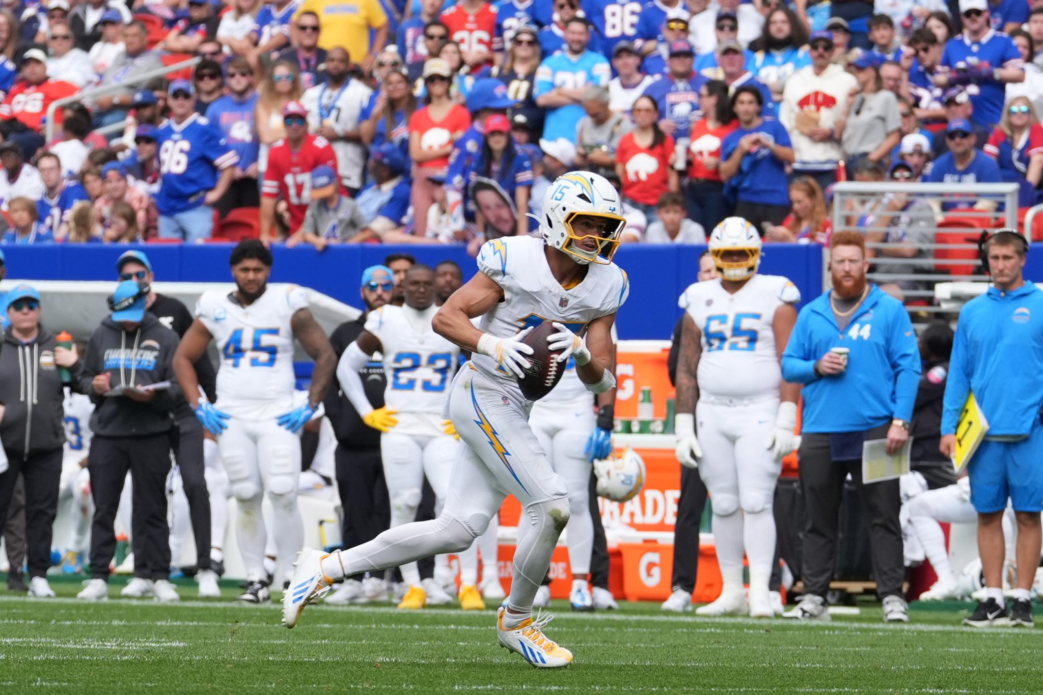 Los Angeles Chargers player runs with the football on the field during the game against the Buffalo Bills.