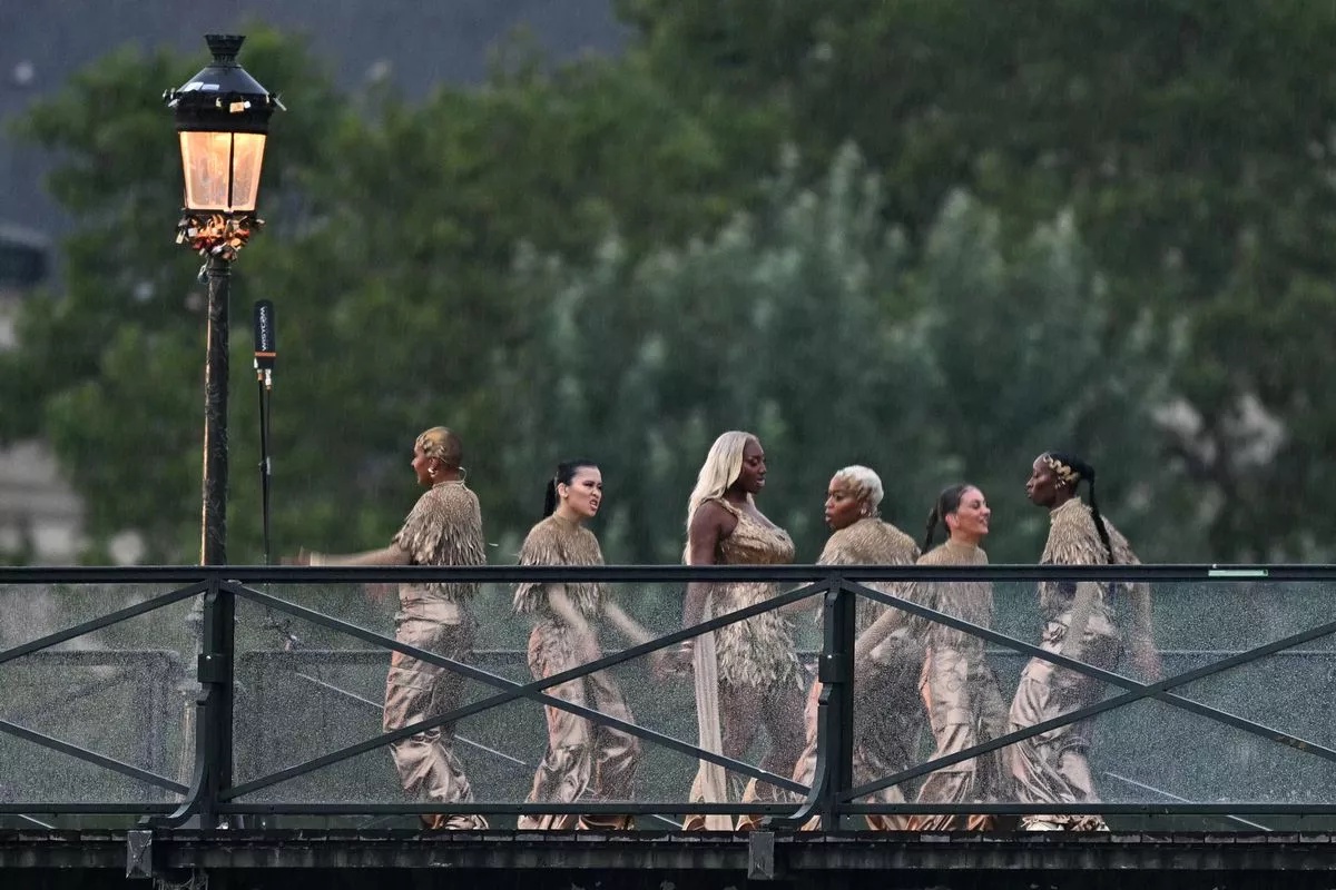 Aya Nakamura walked on Paris' Pont des Arts, singing three iconic French hits during Friday's opening ceremony for the Olympic Games