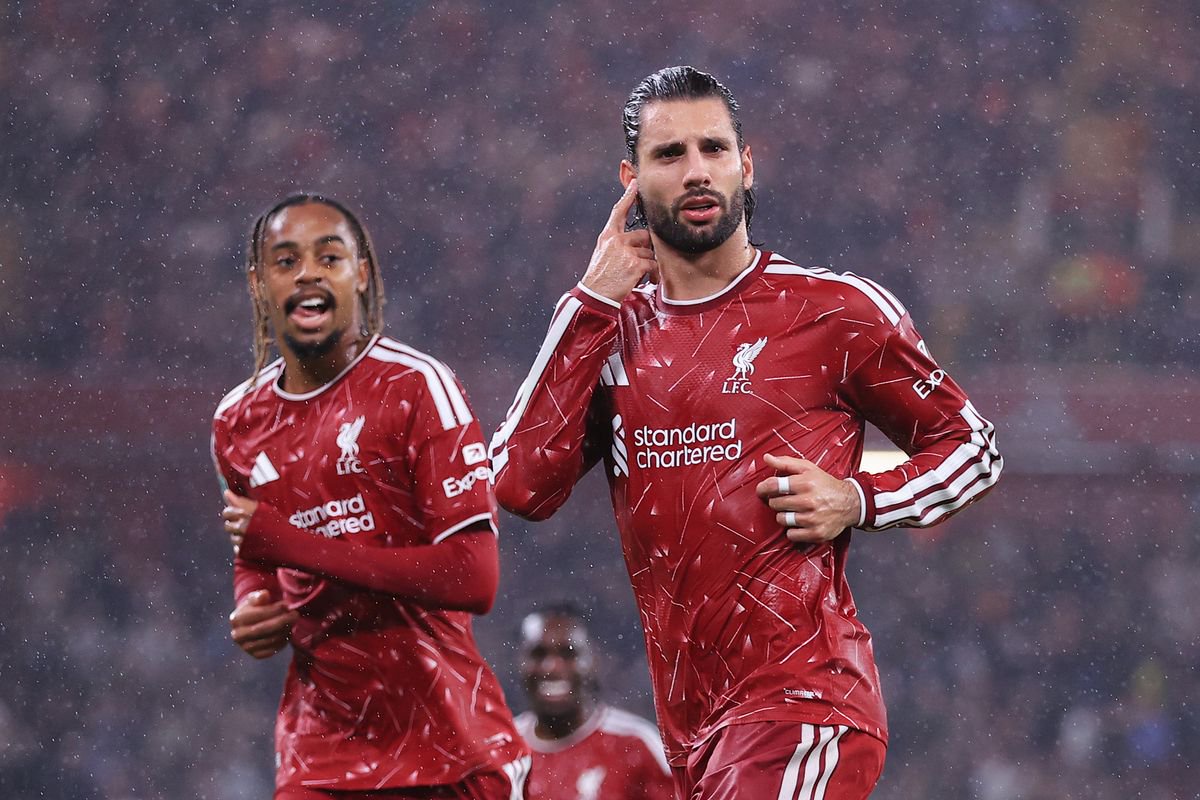 Dominik Szoboszlai of Liverpool (R) celebrates with Bradley Barcola of Liverpool after scoring their 3rd goal during the Carabao Cup Third Round match between Liverpool and Tottenham Hotspur at Anfield on September 15, 2026 in Liverpool, England.