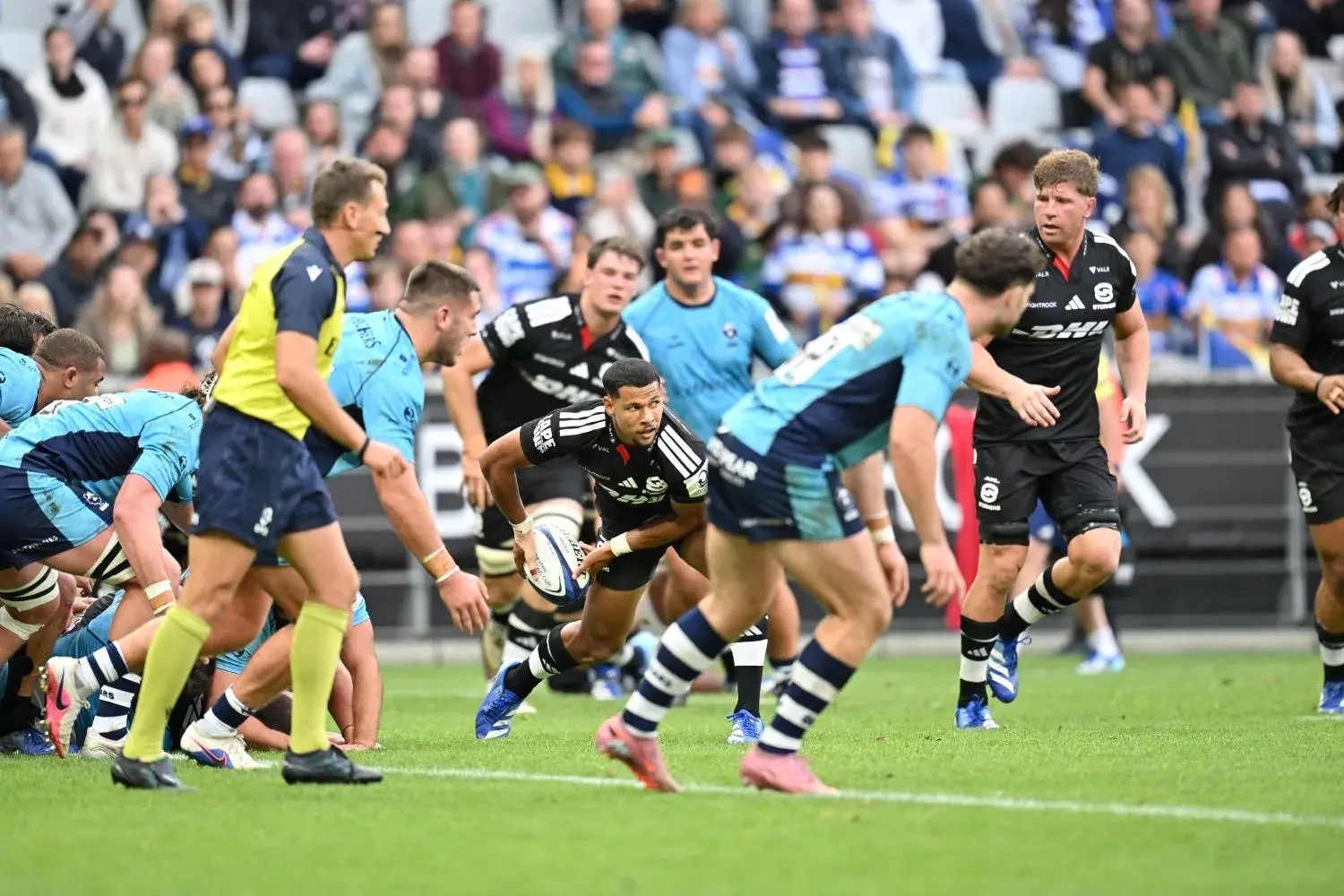 The Bulls, Sharks, and Stormers secured bonus-point victories in round four of the URC, strengthening their positions in the top five. The Lions lost to unbeaten Edinburgh and dropped to 11th place in the standings. New Stormers scrumhalf Haashim Pead is seen with ball in hand.