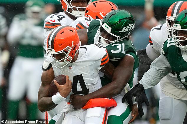 Cleveland Browns quarterback Deshaun Watson (4) is sacked by New York Jets linebacker David Bailey (31) during the first half of an NFL football game, Sunday, Oct. 11, 2026, in East Rutherford, N.J. (AP Photo/Yuki Iwamura)