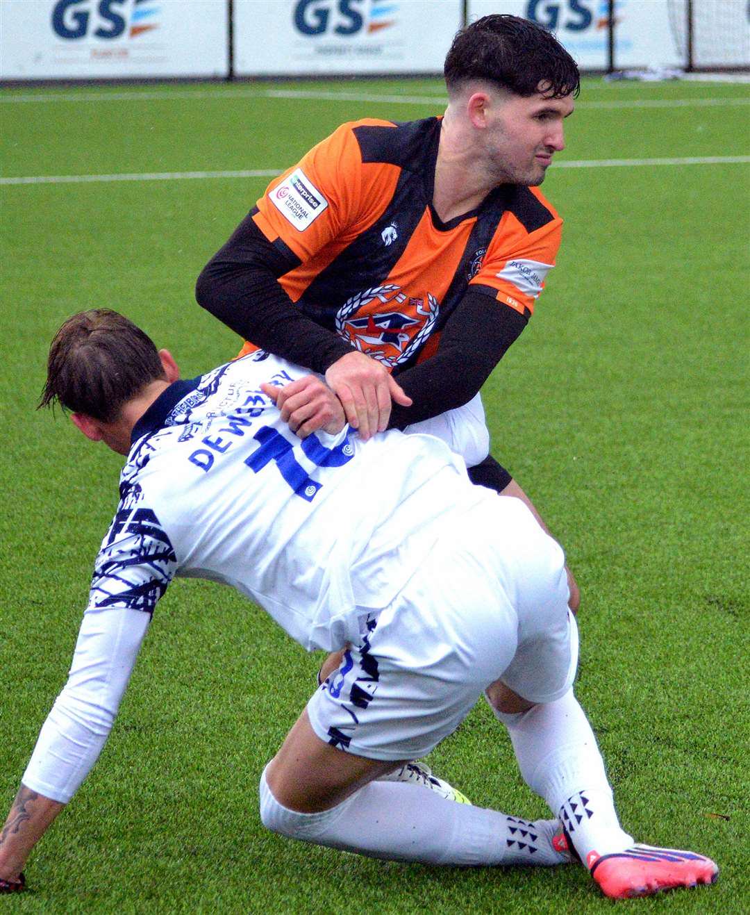 Ben Mason, of Folkestone, in the thick of it against Farnborough's Ollie Dewsbury. Picture: Randolph File