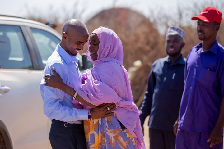 The running legend,  real name Hussein Abdi Kahin, admitted making up key details about moving to the UK (pictured reunited with his mum after decades)