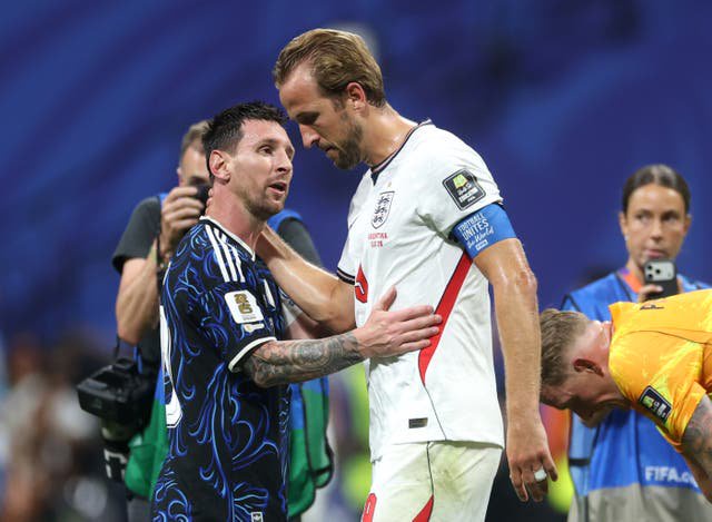 Lionel Messi and Harry Kane embrace at the end of the World Cup semi-final