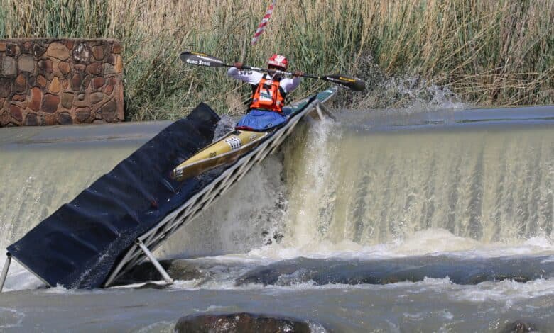 The 2026 Croc Canoe Marathon winner, Siseko Ntondini, shoots the weir. > Photo: Supplied/Jennie Dallas - PaddleSport Gauteng