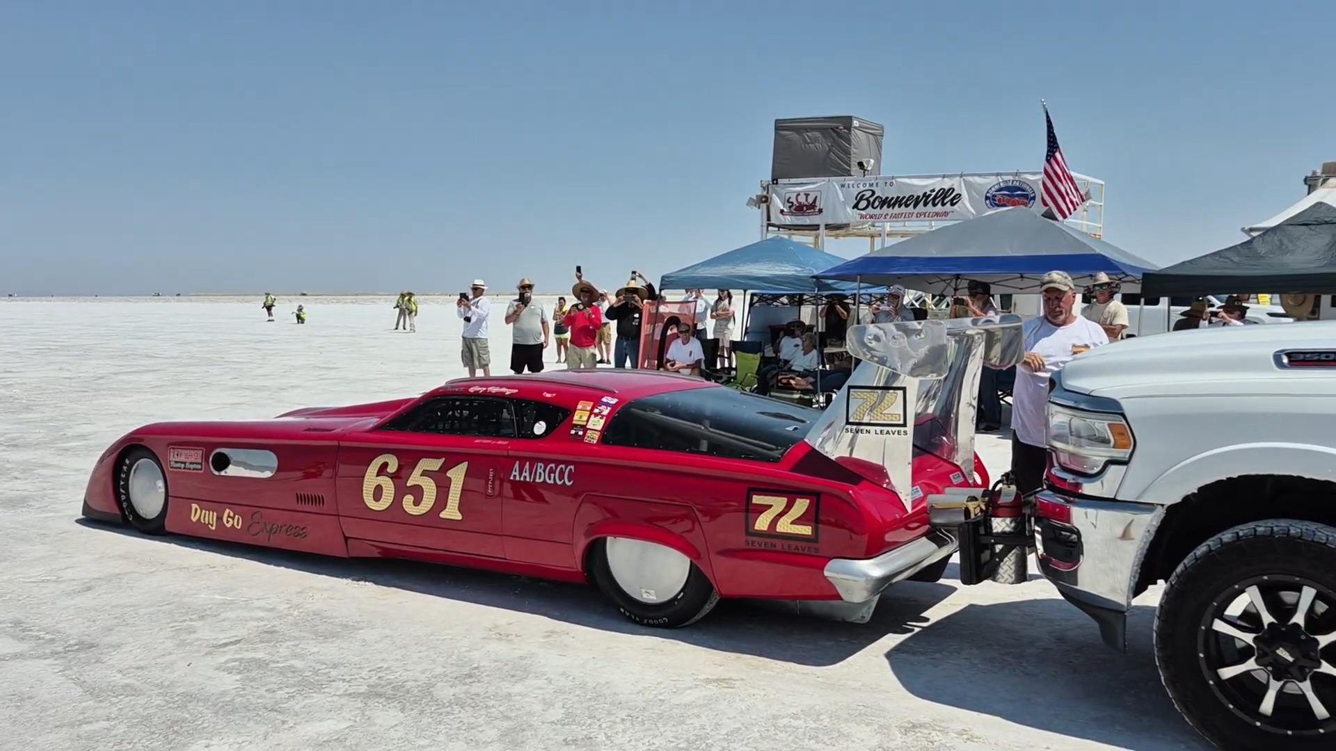 Gary Matranga's red race car, number 651, hitched to a truck at the Bonneville Salt Flats.