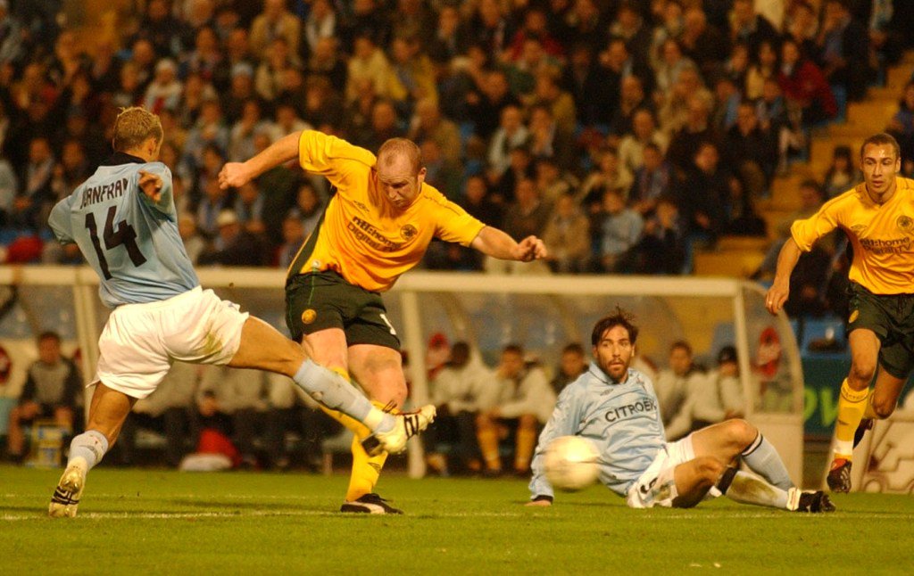 John Hartson scores a goal for Celtic against Celta Vigo.