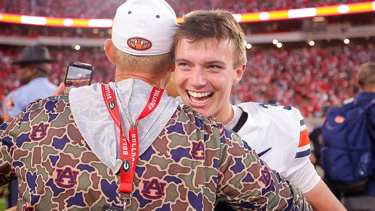 Alex McPherson reacts after kicking a field goal at Sanford Stadium.