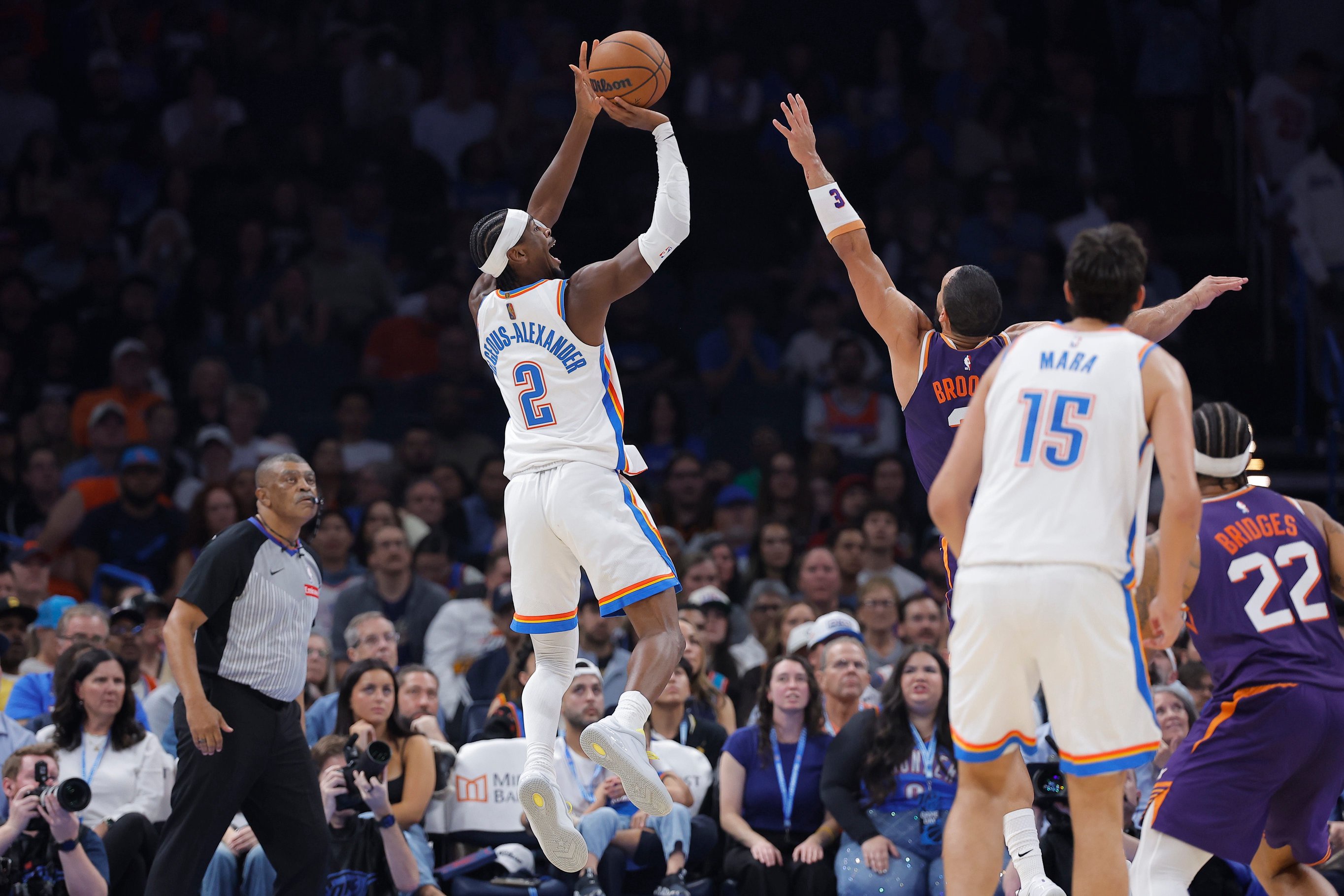 Oct 26, 2026; Oklahoma City, Oklahoma, USA; Oklahoma City Thunder guard Shai Gilgeous-Alexander (2) shoots against the Phoenix Suns during the first half at Paycom Center. Mandatory Credit: Alonzo Adams-Imagn Images