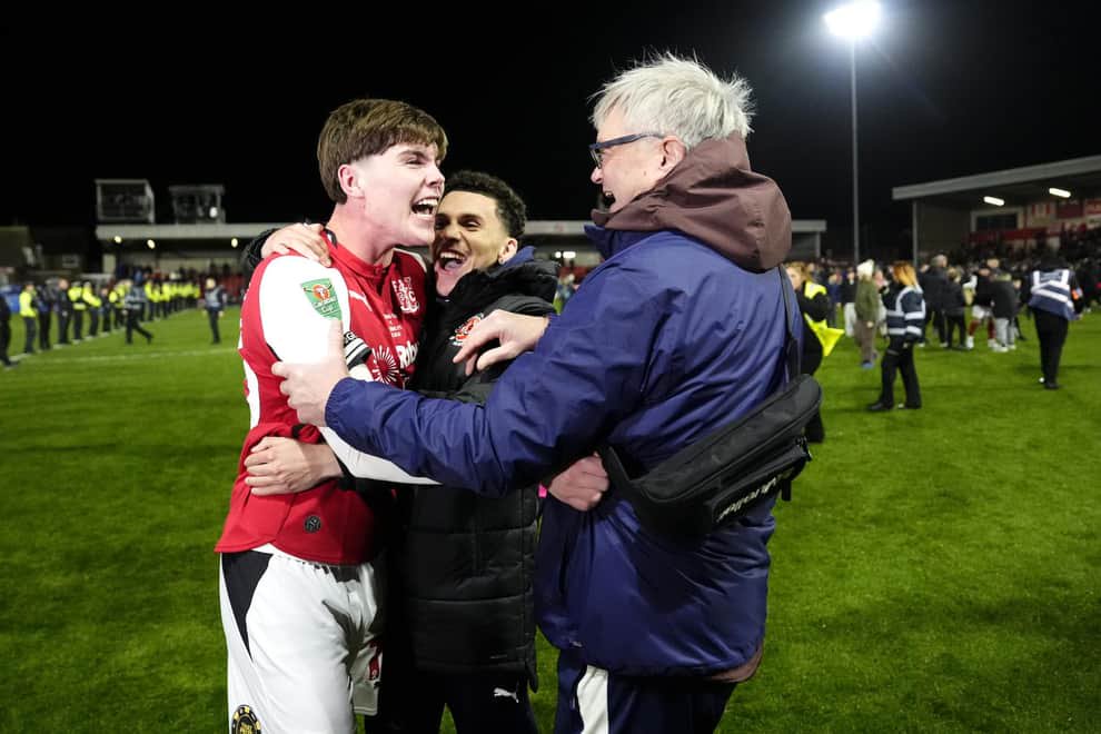 Northern Ireland-born Conor Haughey (left) celebrates with Fleetwood Town fans after his winning shoot-out penalty in a shock Carabao Cup success over Arsenal. (Photo by Nick Potts/Press Association)