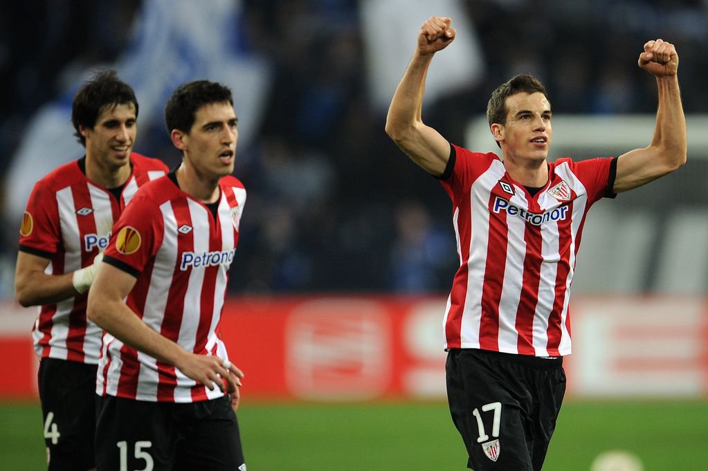 Inigo Perez of Bilbao celebrates with teammates Javi Martinez and Andoni Iraola after the UEFA Europa Leauge quarter final first leg match between FC Schalke 04 and Athletic Bilbao