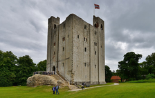 Essex Castles: a tall, thin square castle building, with people walking across the lawn in front of it