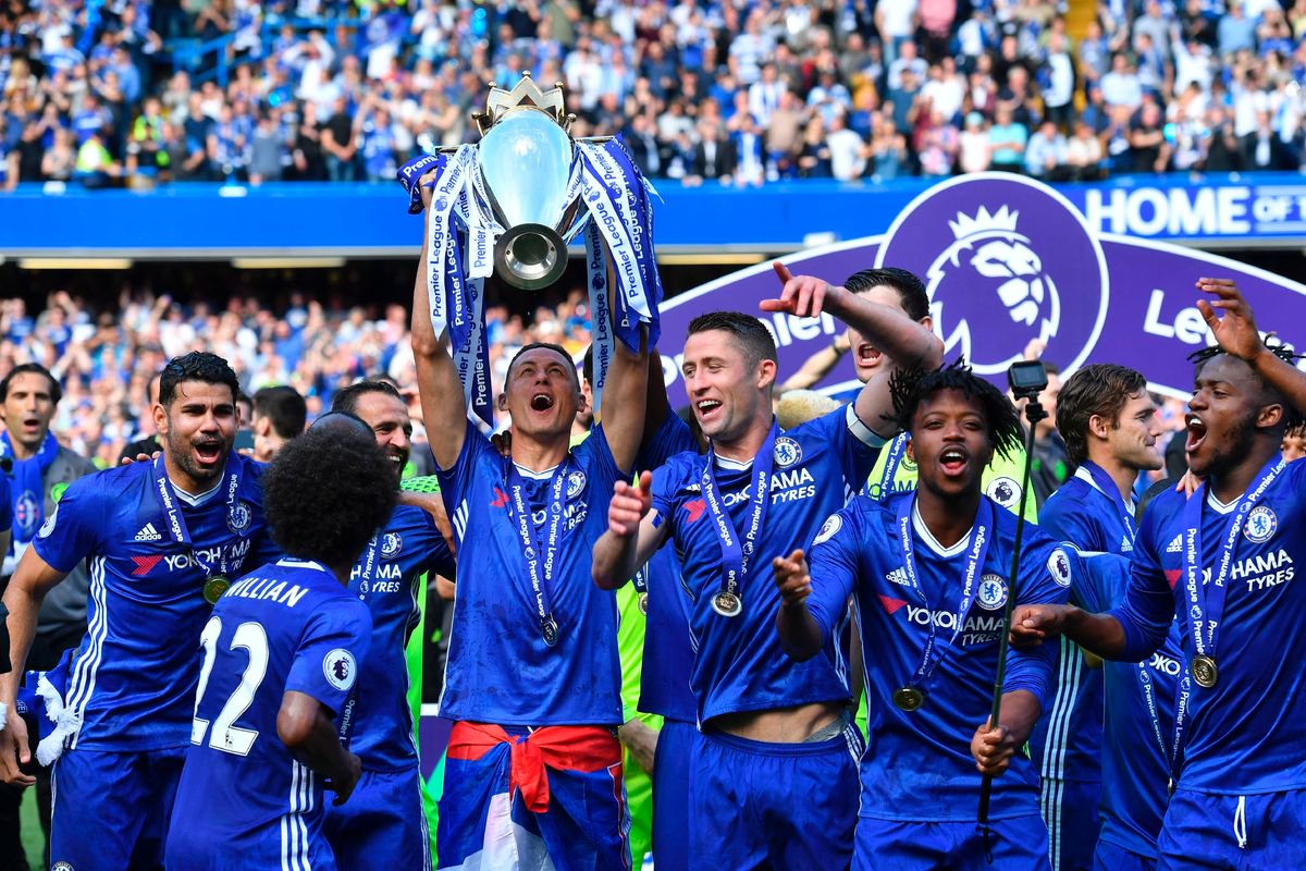 Chelsea midfielder Nemanja Matic holds up the English Premier League trophy