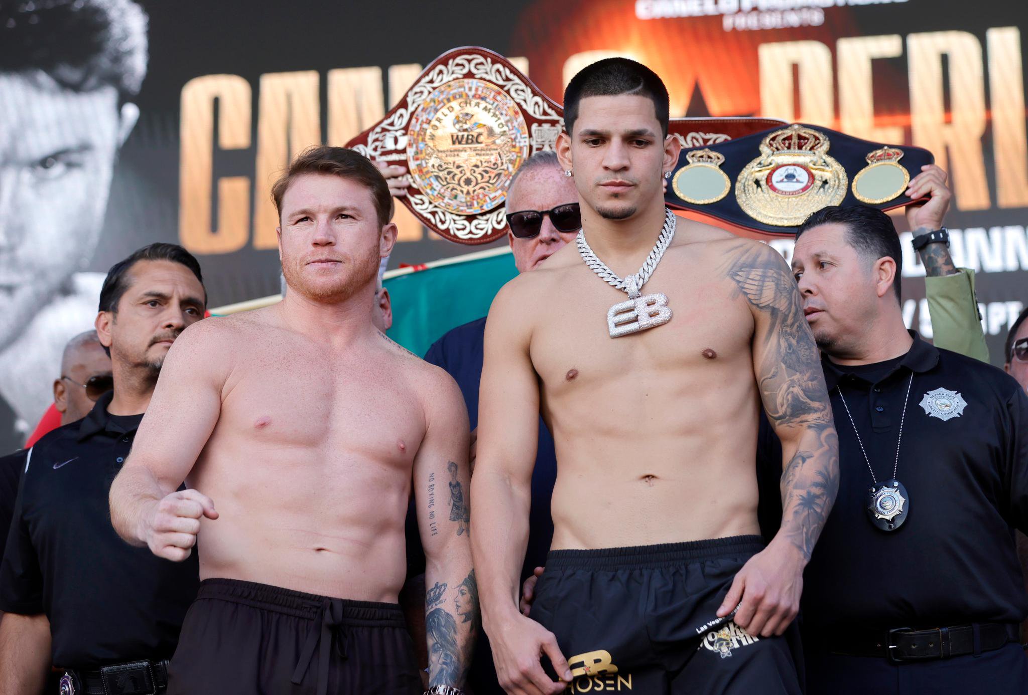 WBC/WBA/WBO super middleweight champion Canelo Alvarez and challenger Edgar Berlanga pose during a ceremonial weigh-in.