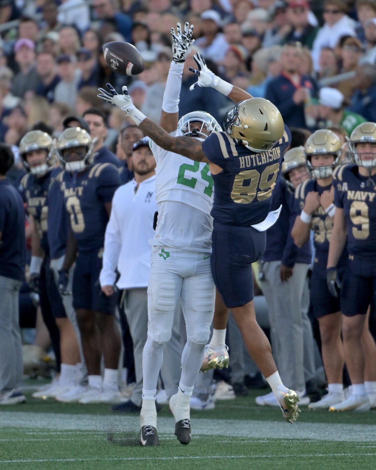 North Texas Mean Green defensive back Peyton Taylor #24 gets called for pass interference on a throw to Navy Midshipmen tight end Merrick Barlow #88 in the second quarter. The Navy Midshipmen host the visiting North Texas Mean Green in an NCAA football game Saturday at Navy-Marine Corps Memorial Stadium in Annapolis. (Paul W. Gillespie/Staff)