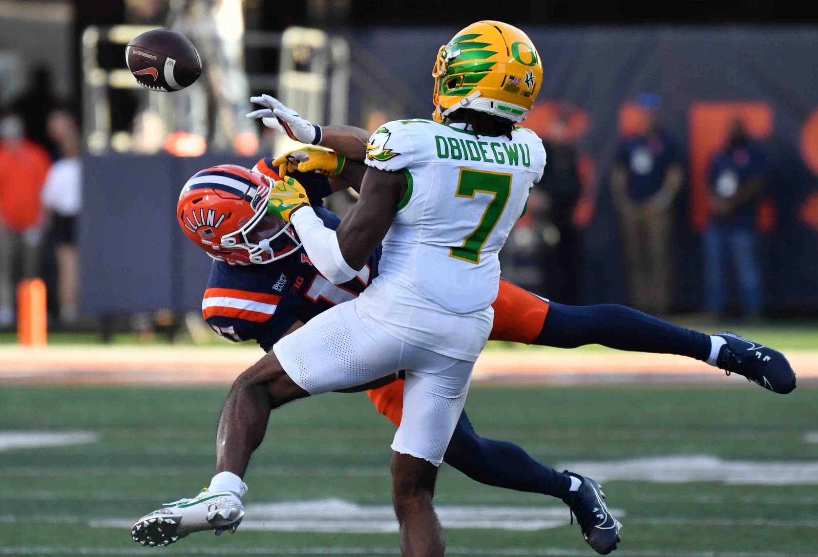 Oct 24, 2026; Champaign, Illinois, USA;  Oregon Ducks defensive back Ivy Obidegwu (7) breaks up a pass intended for Illinois Fighting Illini wide receiver Collin Dixon (17) during the second half at Gies Memorial Stadium.  Mandatory Credit: Ron Johnson-Imagn Images