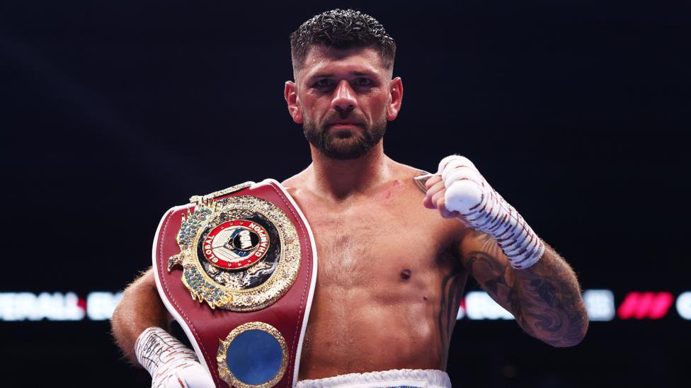 Joe Cordina celebrates with world title belt