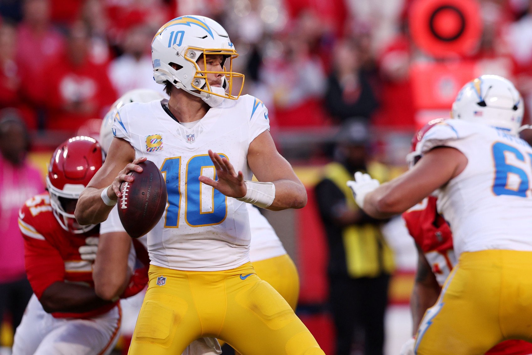 Oct 18, 2026; Kansas City, Missouri, USA;  Los Angeles Chargers quarterback Justin Herbert (10) looks to pass during the fourth quarter against the Kansas City Chiefs at GEHA Field at Arrowhead Stadium.  Mandatory Credit: William Purnell-Imagn Images