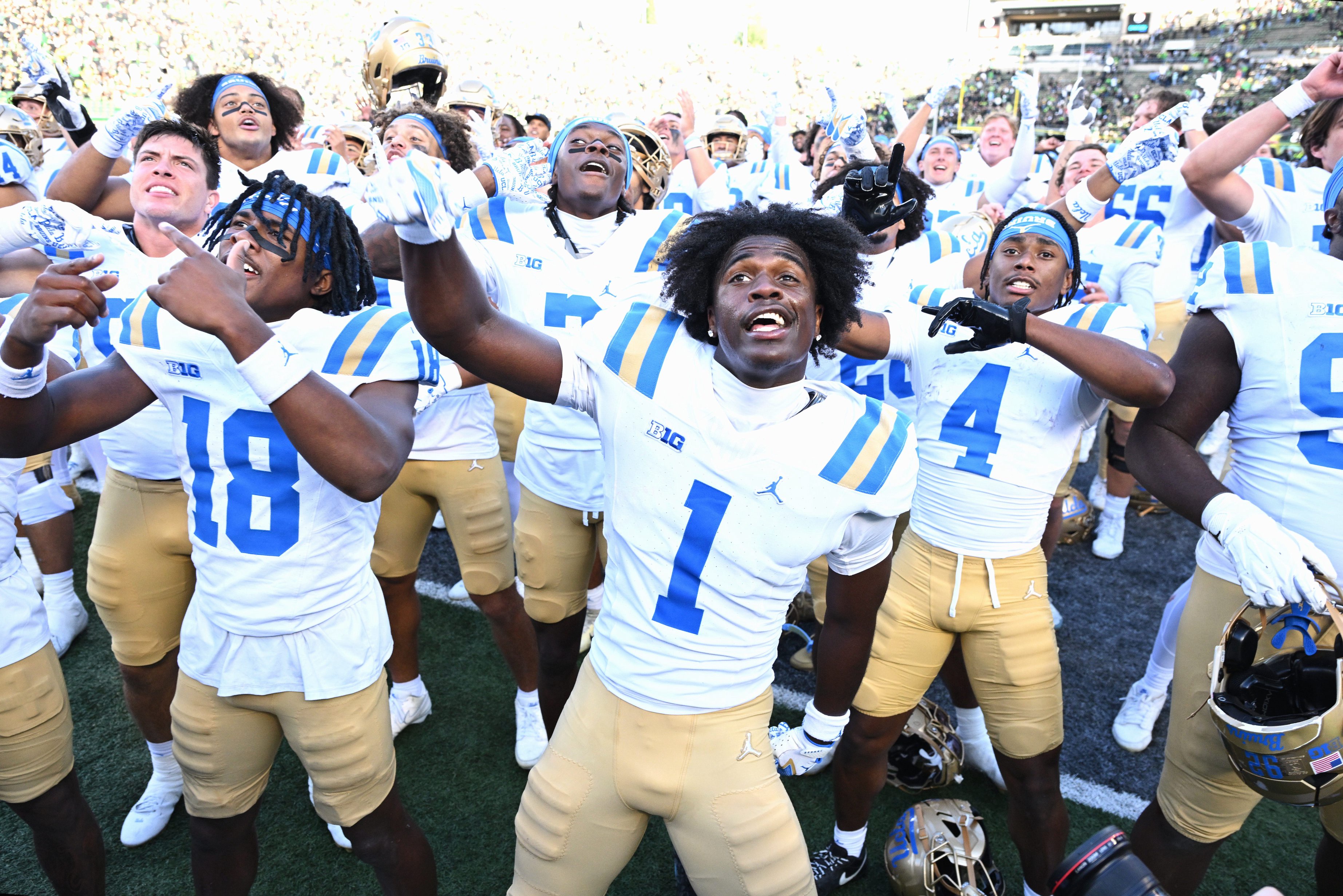 Oct 10, 2026; Eugene, Oregon, USA;  UCLA Bruins wide receiver Aidan Mizell (1) and team mates celebrate the win against the Oregon Ducks at Autzen Stadium.  Mandatory Credit: Troy Wayrynen-Imagn Images