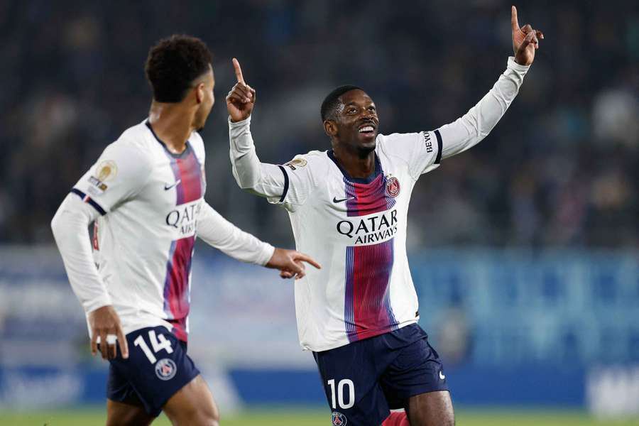 Dembele (R) celebrates his goal