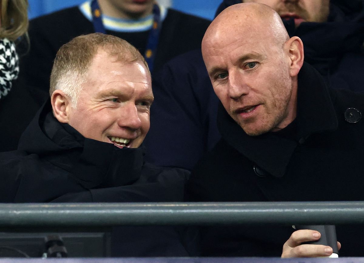 Salford City's CEO and co-owner Nicky Butt (R) and co-owner Paul Scholes react ahead of the English FA Cup third round football match between Manchester City and Salford City at the Etihad Stadium