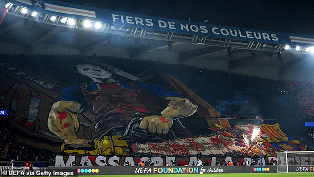 The banner carried the slogan ‘Massacre, Parisien style’ and depicted a blood-spattered masked man in a PSG shirt cutting through a Barcelona crest with a chainsaw