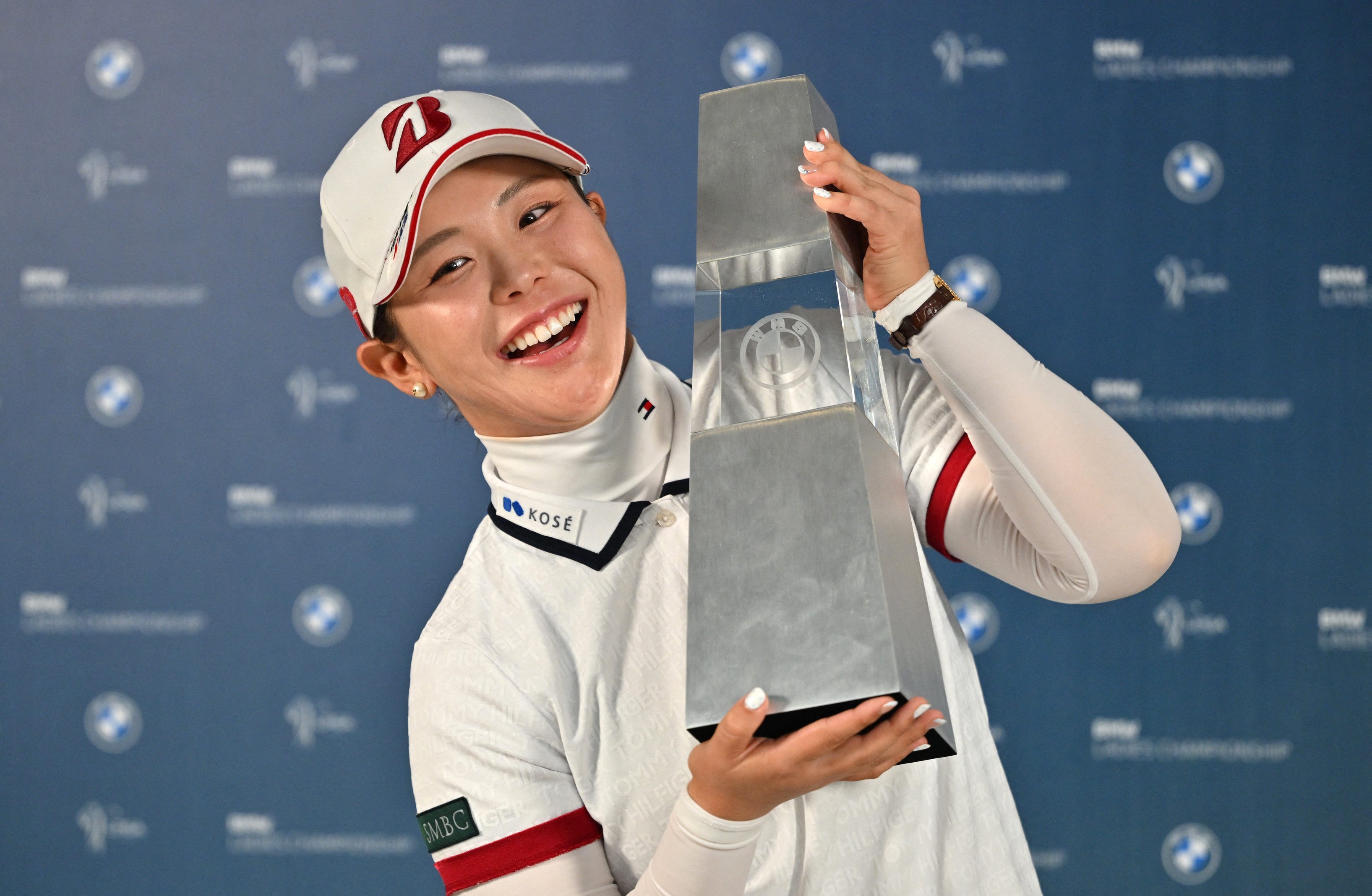 Yuri Yoshida of Japan poses with the trophy after her victory in the LPGA Tour - BMW Ladies Championship golf tournament at Pine Beach Golf Links in Haenam on October 25, 2026. 