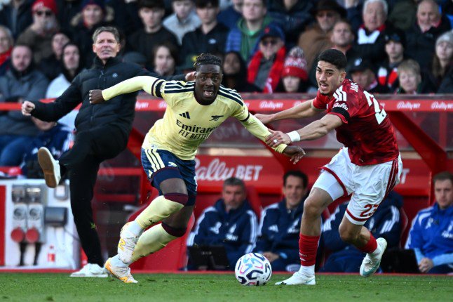 NOTTINGHAM, ENGLAND - OCTOBER 18: Eberechi Eze of Arsenal is challenged by Jair Cunha of Nottingham Forest during the Premier League 2026/27 match between Nottingham Forest FC and Arsenal FC at City Ground on October 18, 2026 in Nottingham, England. (Photo by Stuart MacFarlane/Arsenal FC via Getty Images)
