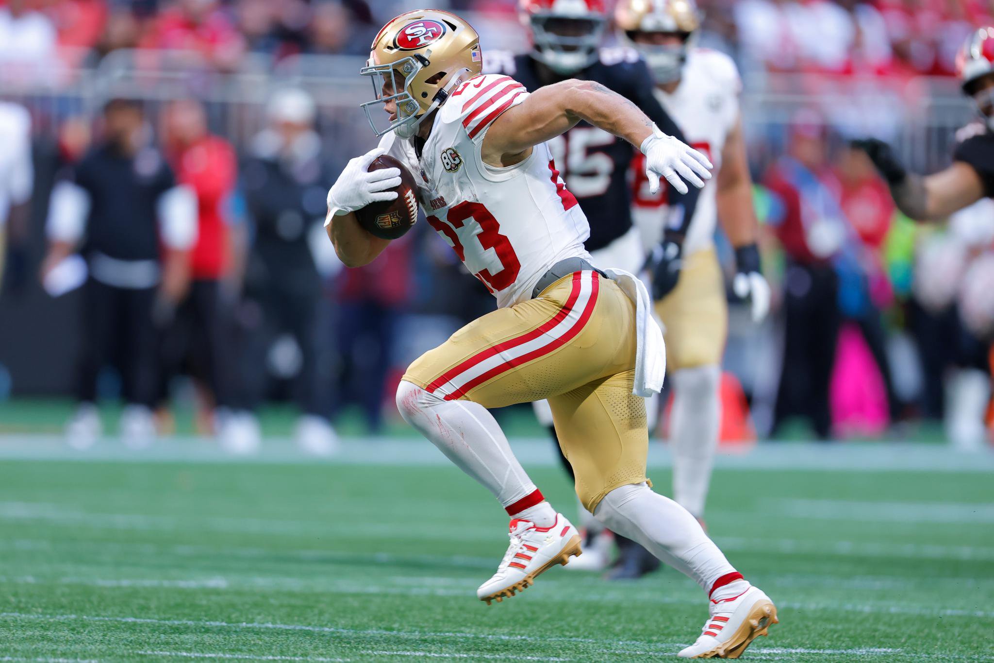 Christian McCaffrey of the San Francisco 49ers rushes with the ball against the Atlanta Falcons.