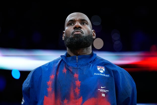 Philadelphia 76ers' LeBron James stands before a preseason NBA basketball game against the Boston Celtics Friday, Oct. 16, 2026, in Philadelphia. (AP Photo/Matt Slocum)