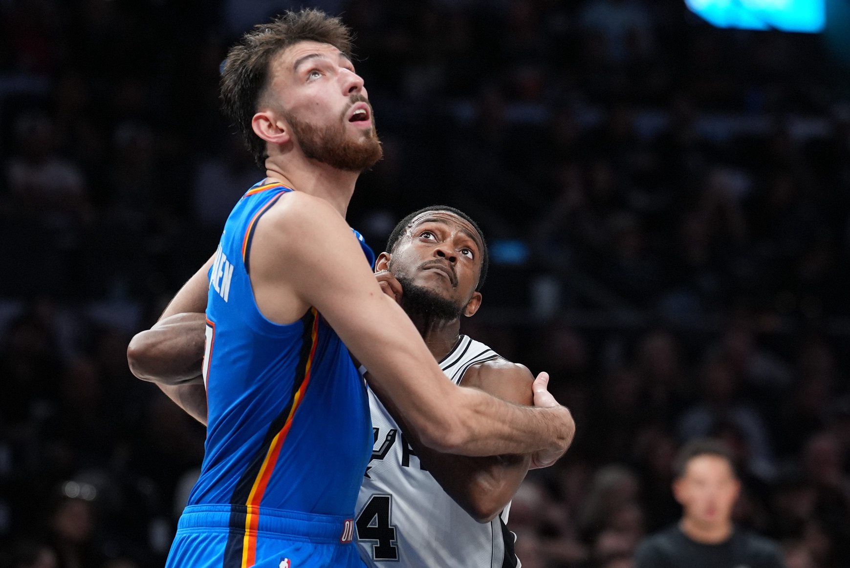 Oct 20, 2026; San Antonio, Texas, USA;  Oklahoma City Thunder center Chet Holmgren (7) and San Antonio Spurs guard De'aaron Fox (4) battle for position in the second half at Frost Bank Center.  Mandatory Credit: Daniel Dunn-Imagn Images