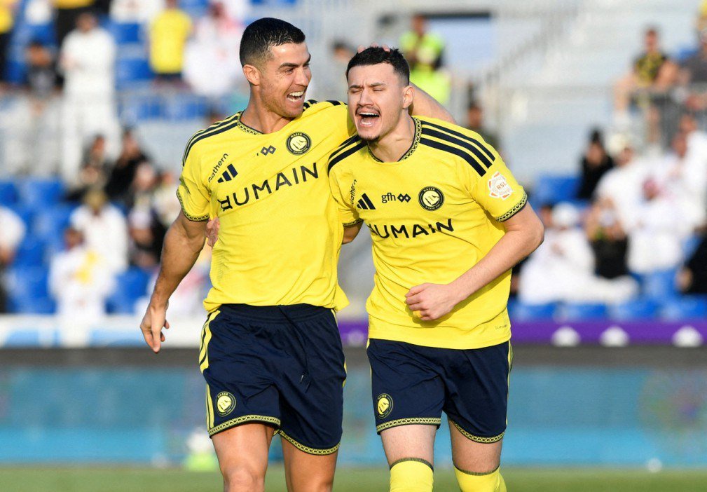 Cristiano Ronaldo and a teammate celebrate during a Saudi Pro League match.