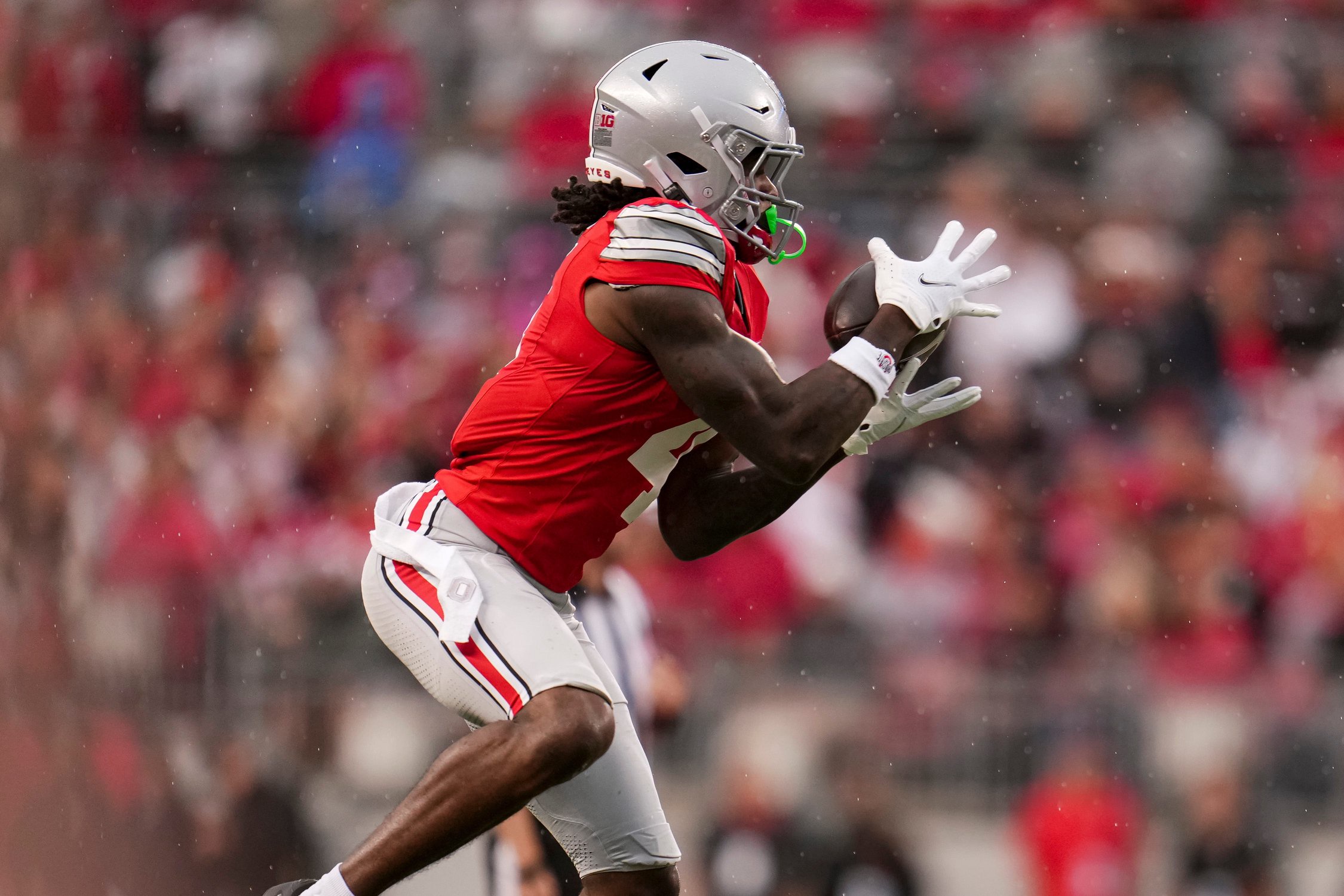 Ohio State Buckeyes wide receiver Jeremiah Smith (4) catches a pass during the NCAA football game against the Maryland Terrapins at Ohio Stadium in Columbus on Oct. 10, 2026.