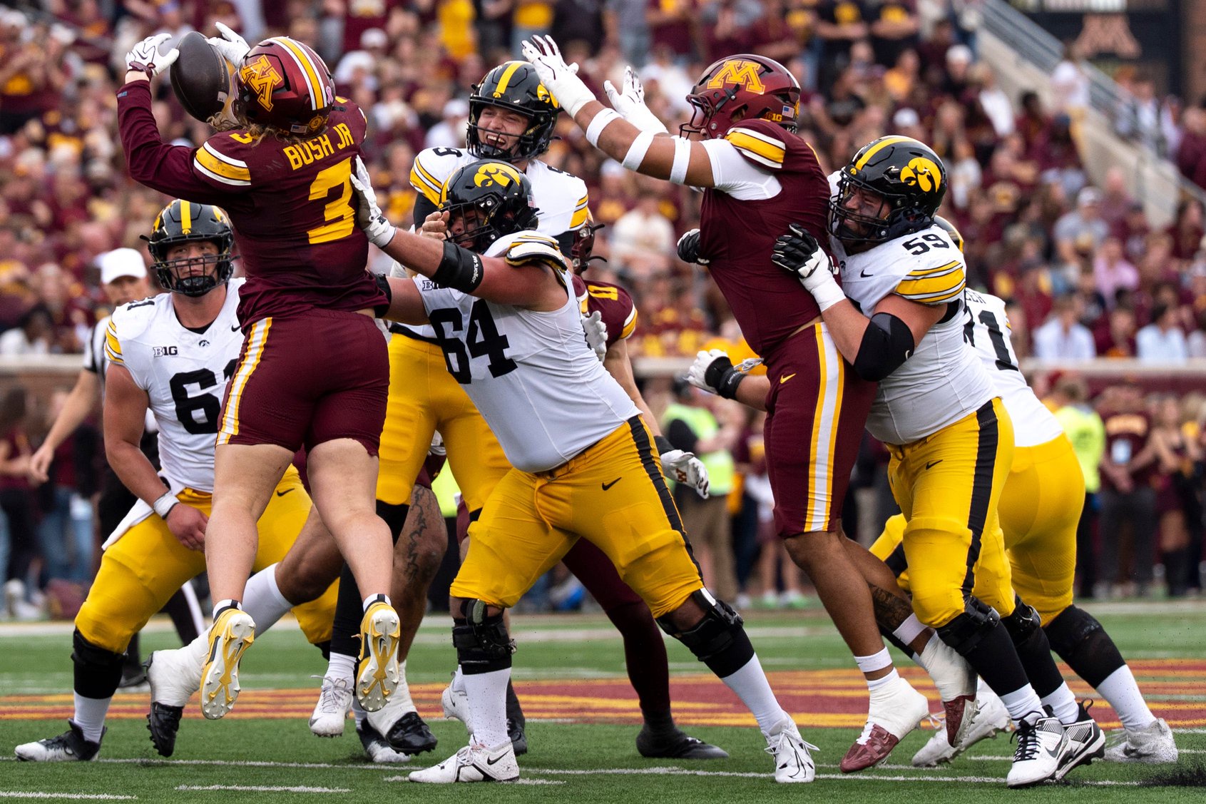 Minnesota’s TJ Bush Jr. (3) intercepts a pass by Iowa Hawkeyes quarterback Hank Brown (9) Oct. 24, 2026 during a Big Ten football game in Minneapolis, Minnesota.