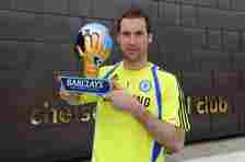 Petr Cech holding the Premier League Golden Glove award trophy