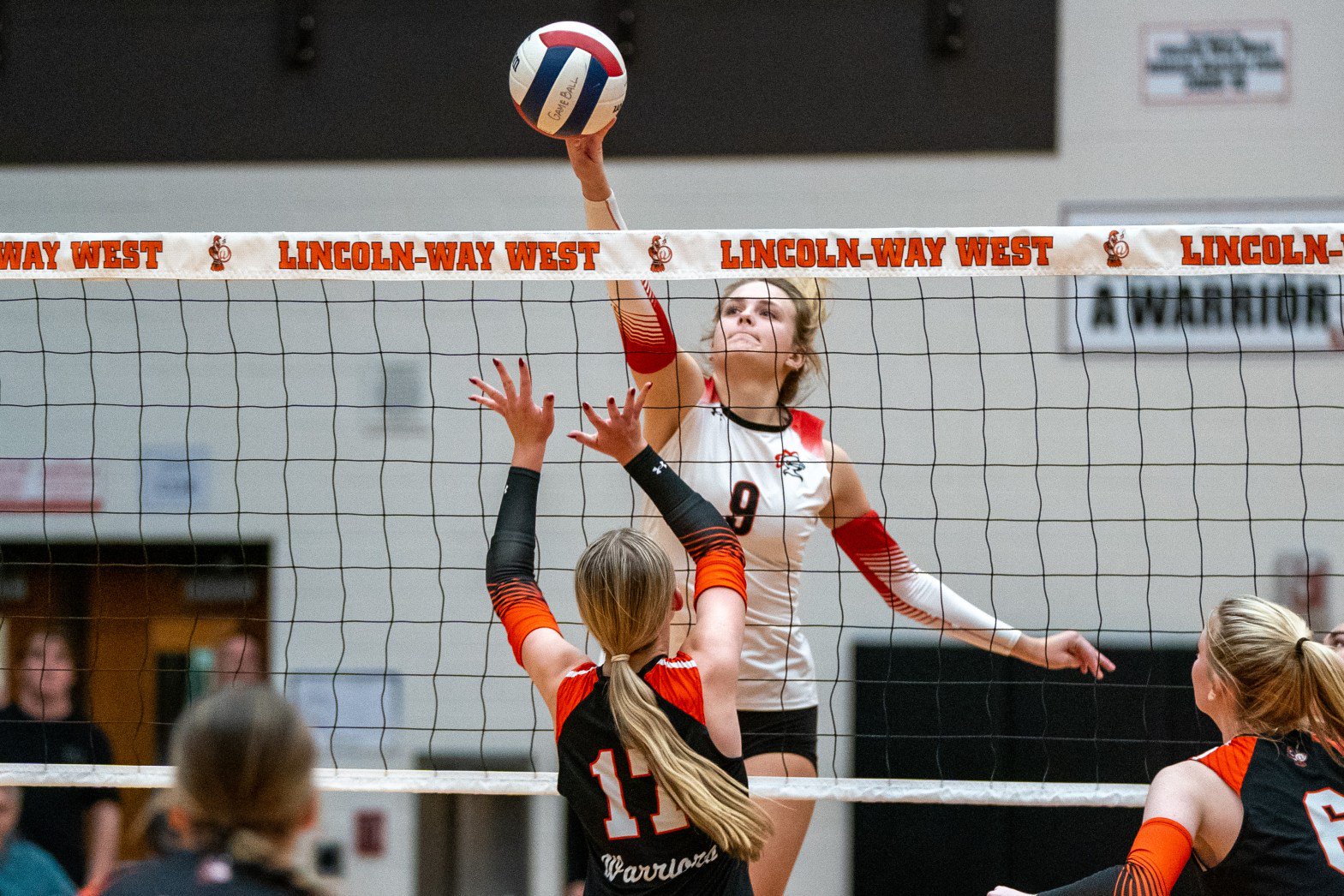Lincoln-Way Central's Stella Davis (9) plays the ball above the net against Lincoln-Way West's Kaylea Armstrong (17) during a Class 4A Lincoln-Way West Regional final in New Lenox on Thursday, Oct. 29, 2026. (Sean King / Daily Southtown)
