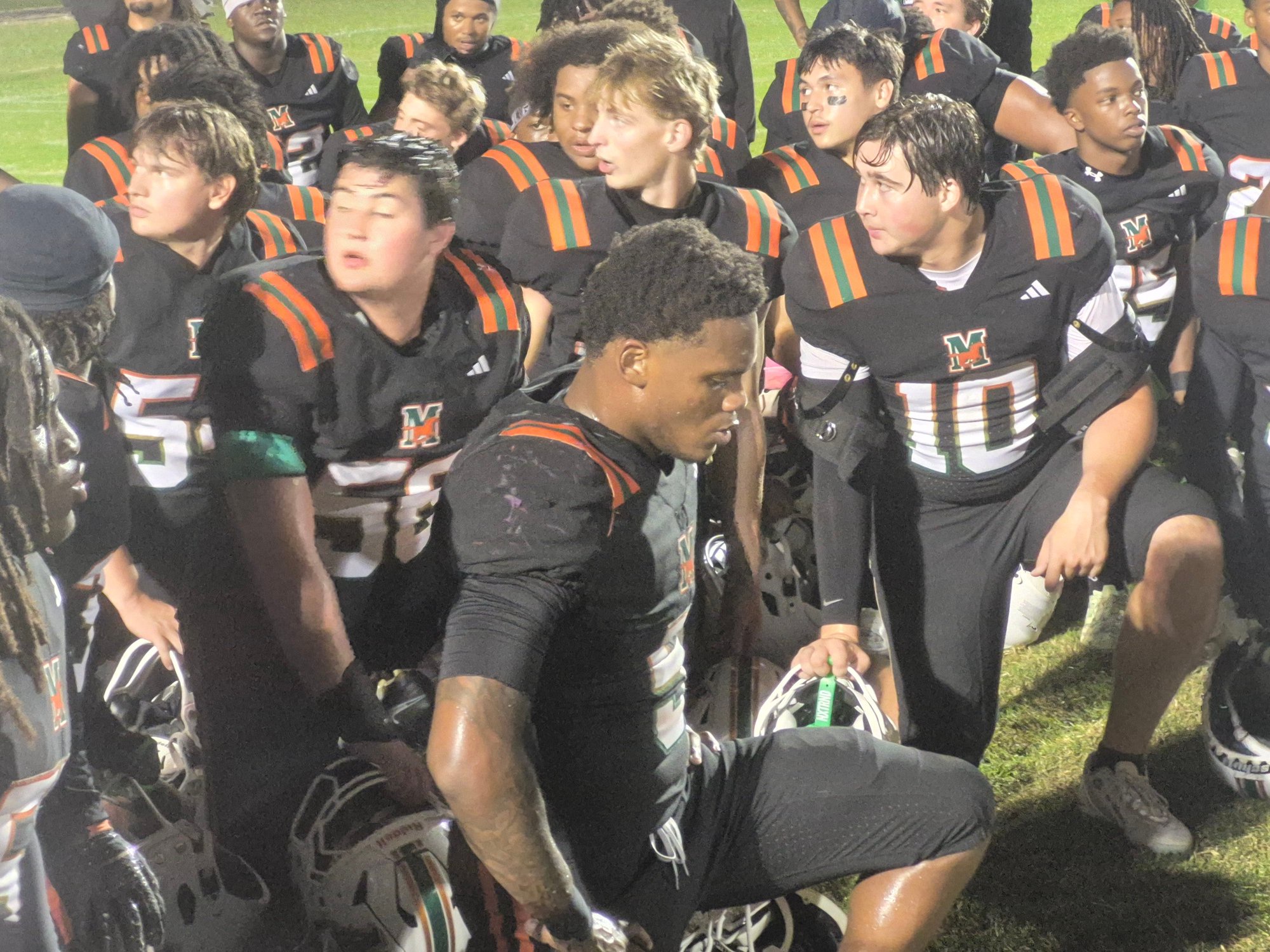 Mandarin players huddle after defeating St. Augustine 32-31 in overtime on Oct. 30, 2026. [Clayton Freeman/Florida Times-Union]