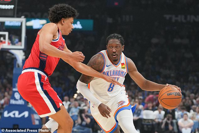 Oklahoma City Thunder guard Jalen Williams, right, drives past Los Angeles Clippers guard Keaton Wagler, left, during the first half of an NBA basketball game, Sunday, Oct. 25, 2026, in Oklahoma City. (AP Photo/Kyle Phillips)