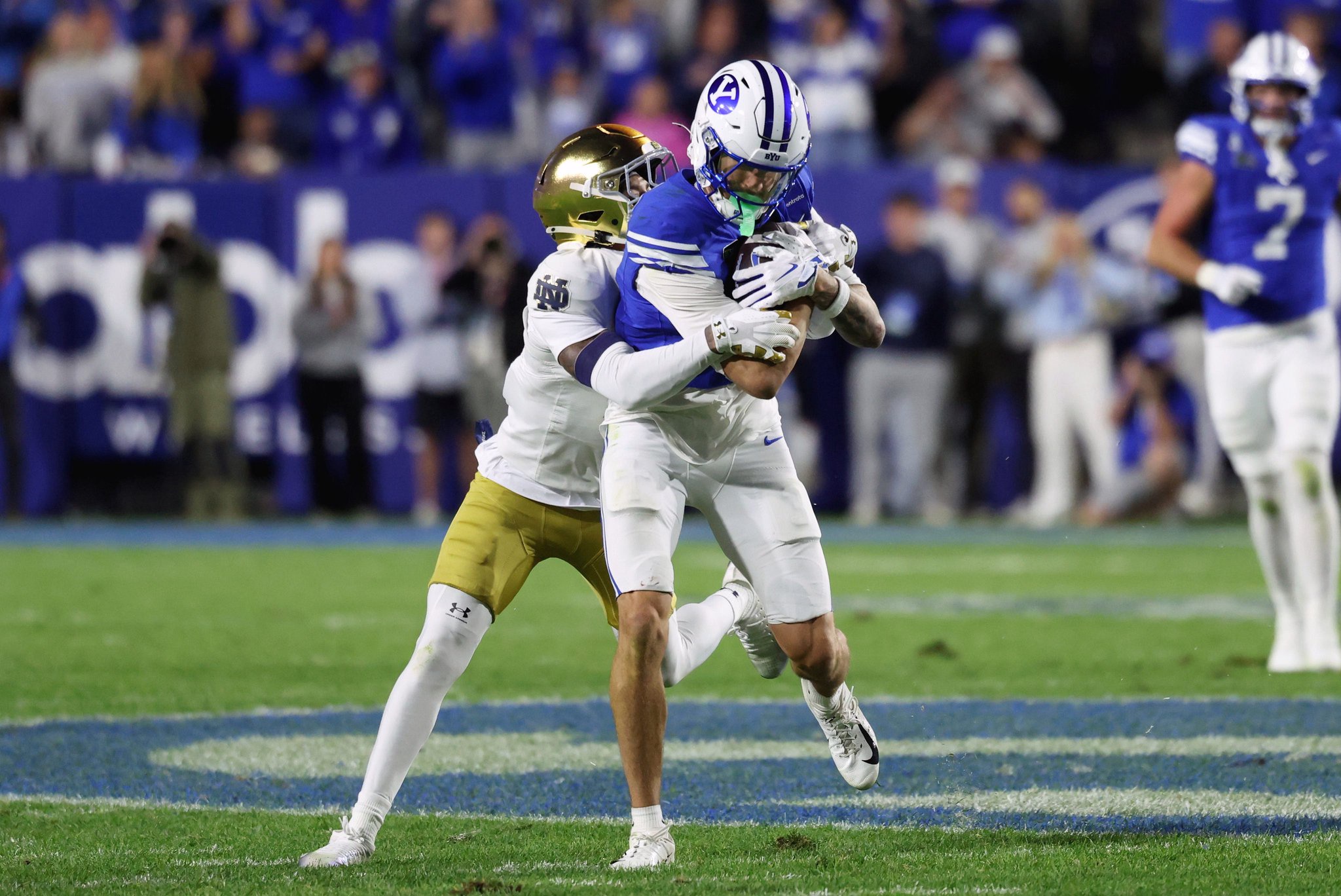 Oct 17, 2026; Provo, Utah, USA;  Notre Dame Fighting Irish cornerback DJ McKinney (2) tackles Brigham Young Cougars wide receiver Kyler Kasper (3) during the second half at LaVell Edwards Stadium.  Mandatory Credit: Rob Gray-Imagn Images
