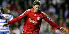 Fernando Torres celebrates with his arms outstreched after scoring for Liverpool.