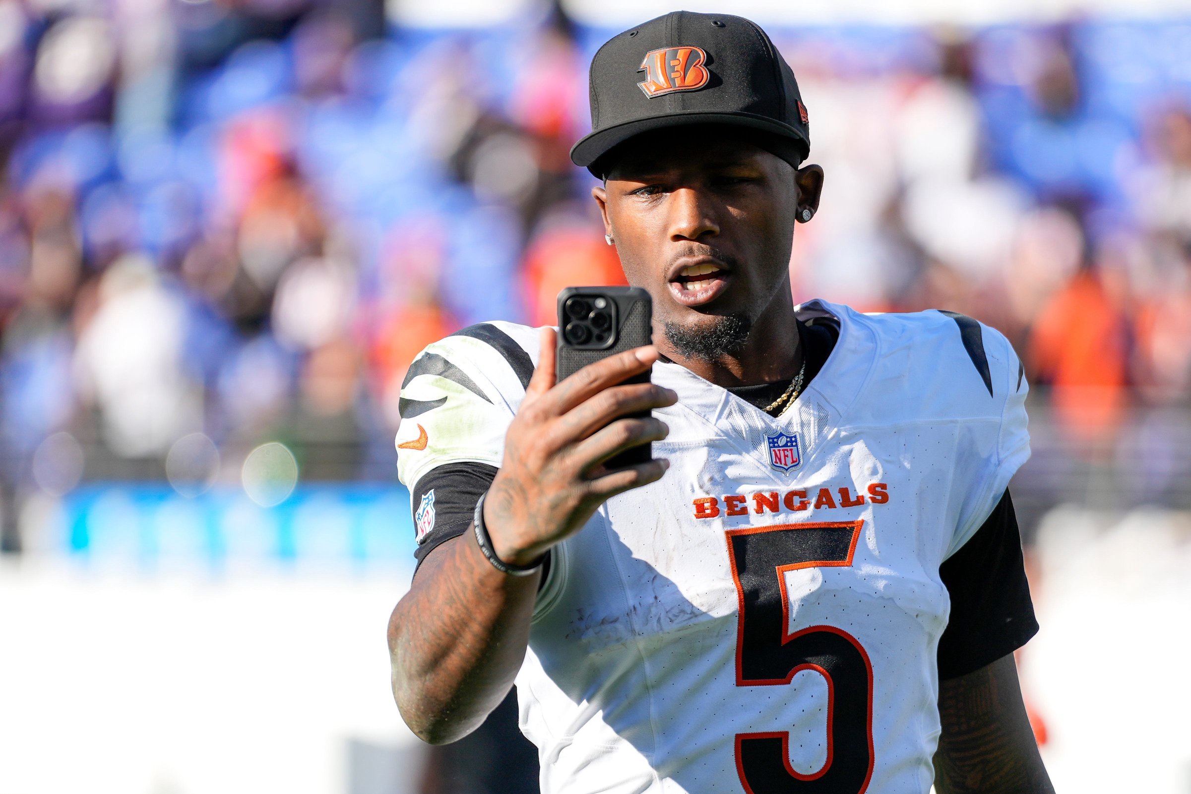 Cincinnati Bengals wide receiver Tee Higgins (5) records a social media video after the fourth quarter of the NFL Week 7 game between the Baltimore Ravens and the Cincinnati Bengals at M&amp;T Bank Stadium in Baltimore on Sunday, Oct. 25, 2026. The Bengals scored 35 points in the second half to win 35-13 on the road.