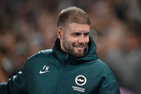 Brighton manager Fabian Hurzeler smiling.