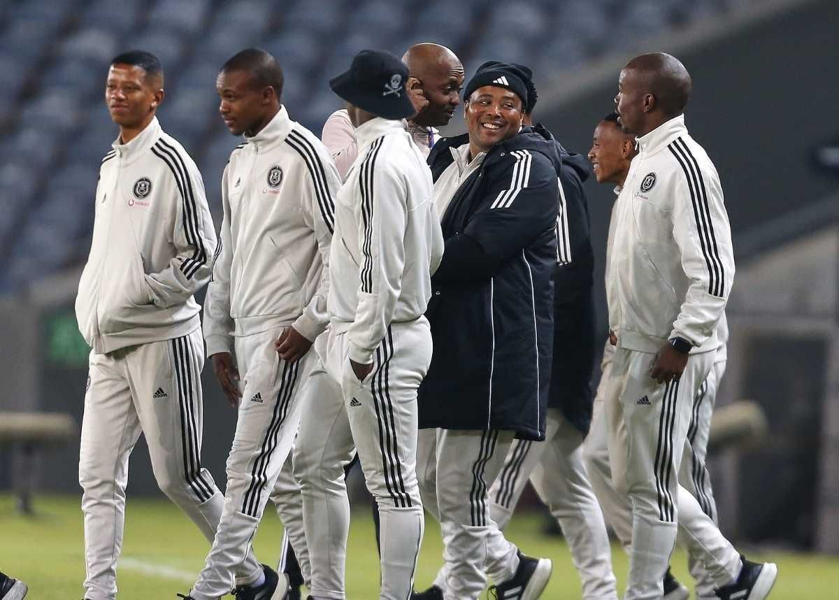 Orlando Pirates team strolling for a pitch inspection at the Orando Stadium