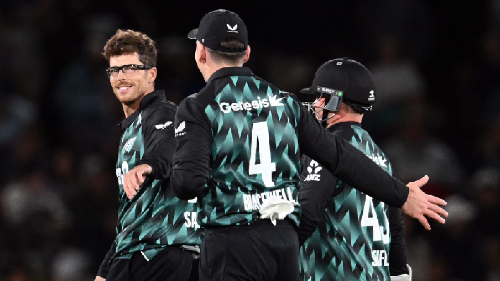 New Zealand's Mitchell Santner and teammates celebrate the dismissal of India's Abhishek Sharma in the 2nd T20I match at Hagley Oval, in Christchurch on Saturday. (ANI Photo)